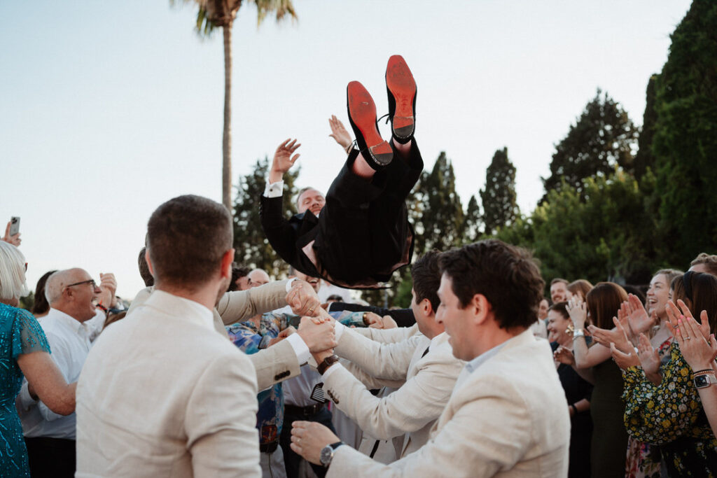 groom flying photo in Rome